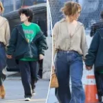 Jennifer Lopez and child Emme, 16, hold hands during flea market outing